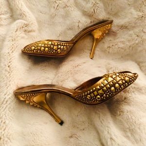 Gucci gold studded mule heel.